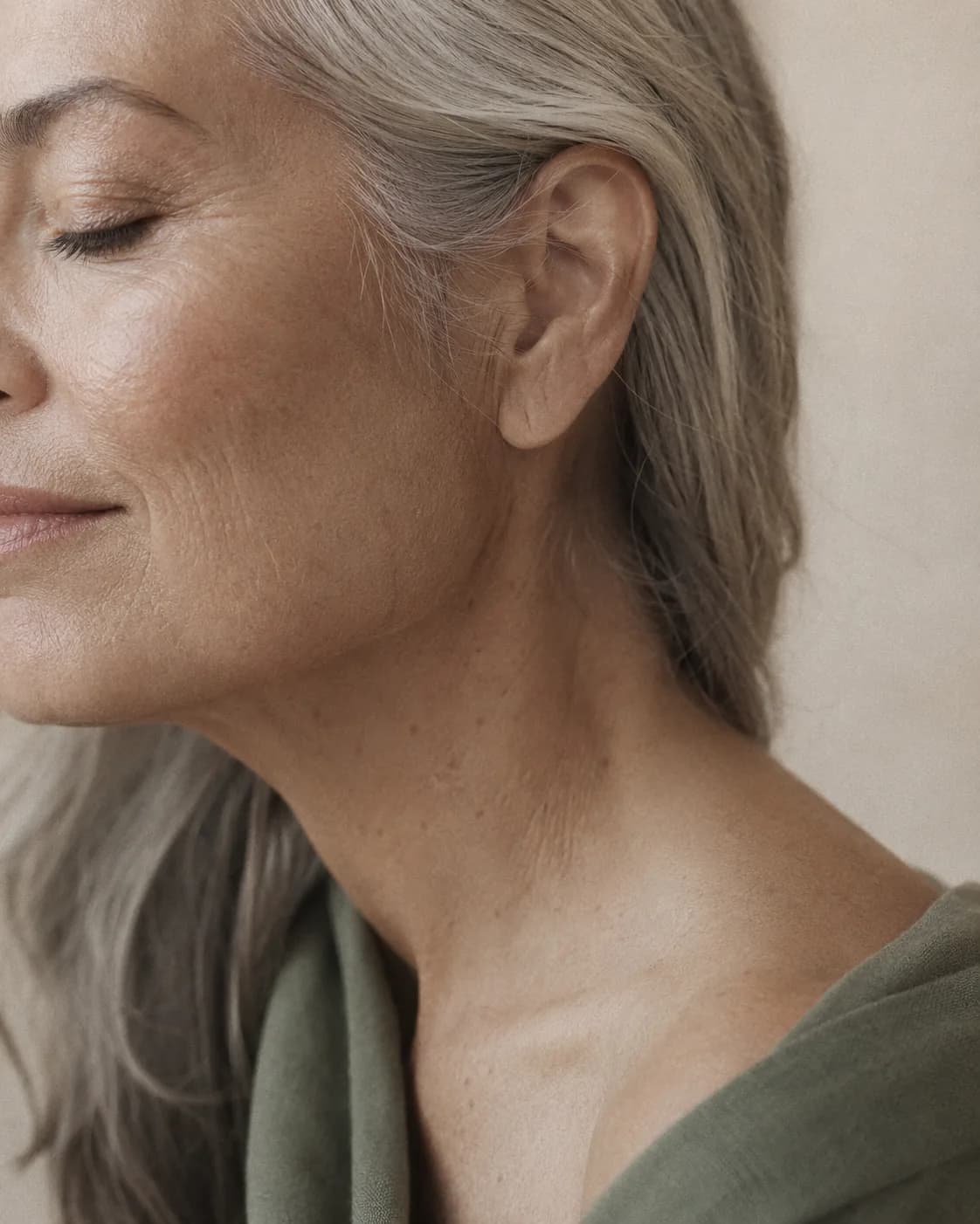 A practitioner's hands working calmly and precisely during a skin treatment, soft even light.